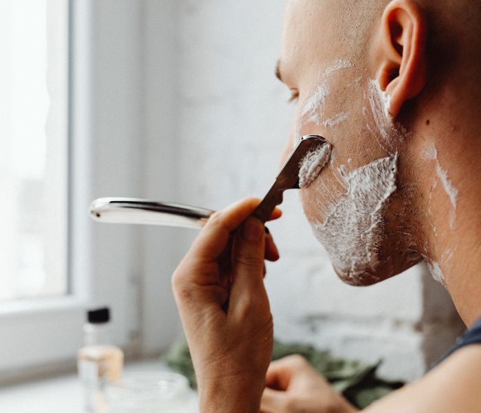 Man shaving face smoothly with soft water